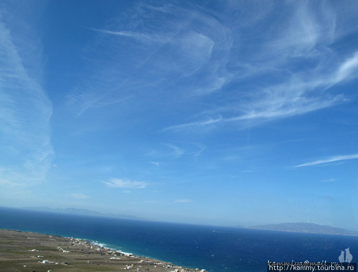 Романтичные облака Остров Санторини, Греция