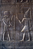 Бог гор и фараон Птолемей XII (при нем храм строили)