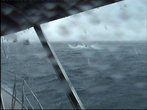 Море встретило нас дождём и штормом,справа по борту буксир тащил подтопленный катамаран.