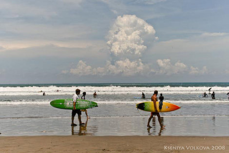 Surfers on Legian beach Кута, Индонезия